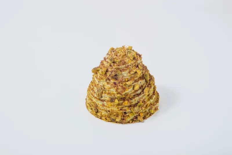 Dubai Macchiato Entremet — A signature Pompadour creation in Los Angeles. This luxurious Dubai Macchiato entremet features espresso-infused chocolate mousse, rich Sicilian pistachio filling, and silky pistachio cream. A modern Ramadan indulgence.