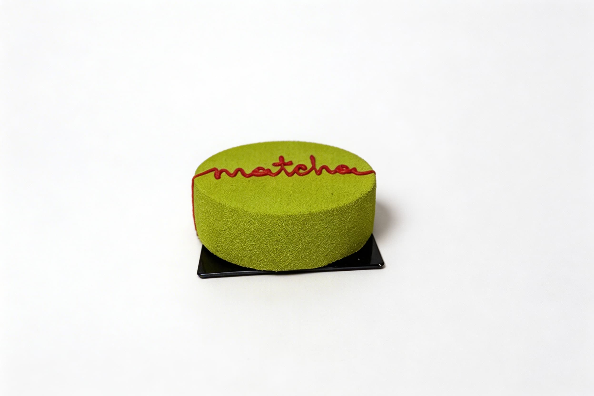 Strawberry Matcha Velvet — Velvety matcha mousse enveloping a vibrant strawberry center, finished with a refined green tea coating. Smooth, elegant, and perfectly balanced.