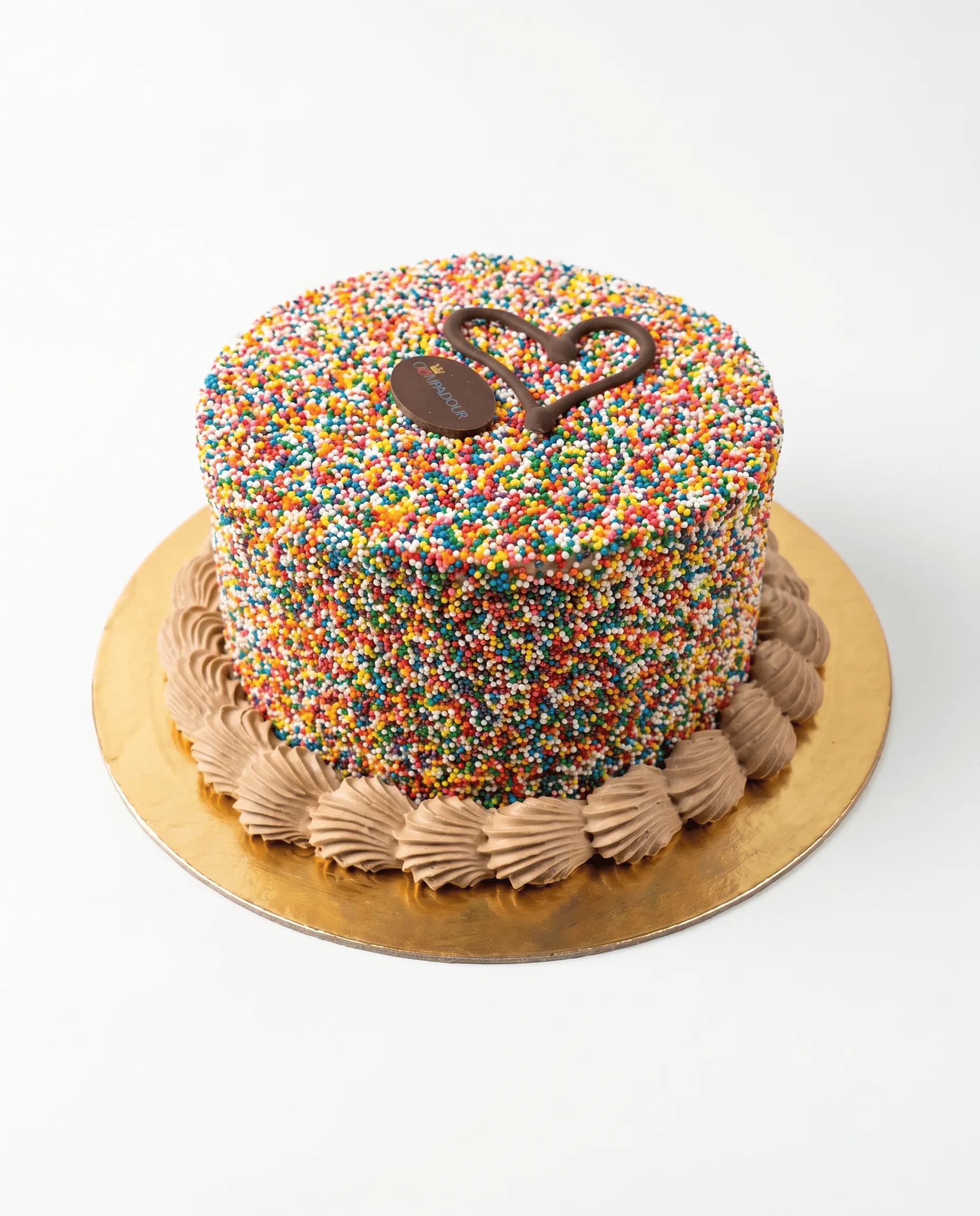 Dot Cake — Silky chocolate cream and rich ganache layered with a decadent chocolate sponge, crafted into a dense and refined cake with a luxurious center of artisanal salted caramel.