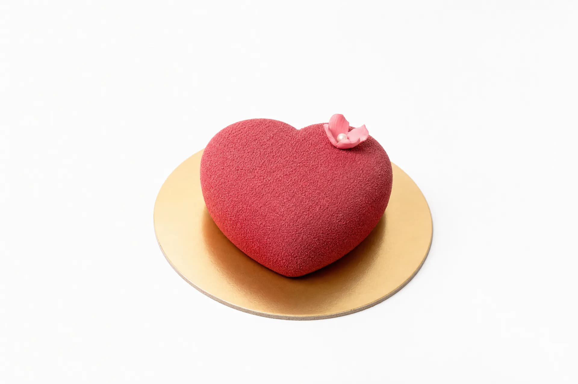 Pink Velvet Heart Cake Mother's Day — Heart-shaped confection featuring red velvet and white exterior, moist chocolate sponge, and silky milk chocolate mousse. Perfect for celebrations.